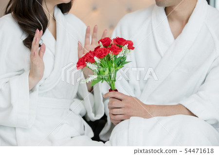 Gentle man giving a bouquet Gentle man giving a bouquet 54471618