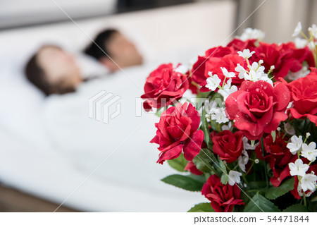 A man and a woman in a bag and bed 54471844