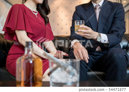 Men and women drinking alcohol Men and women drinking alcohol 54471877