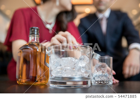 Woman making a drink Woman making a drink 54471885