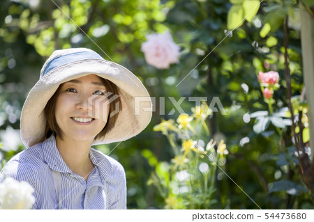Gardening image Woman looking at camera Gardener Gardening image Woman looking at camera Gardener 54473680