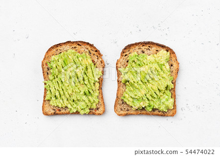 Avocado toast on whole grain sandwich bread Avocado toast on whole grain sandwich bread 54474022