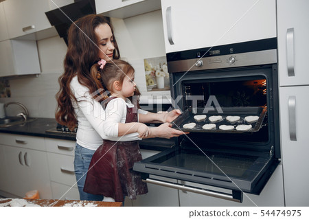 Family cook the dough for cookies 54474975