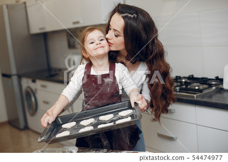 Family cook the dough for cookies Family cook the dough for cookies 54474977