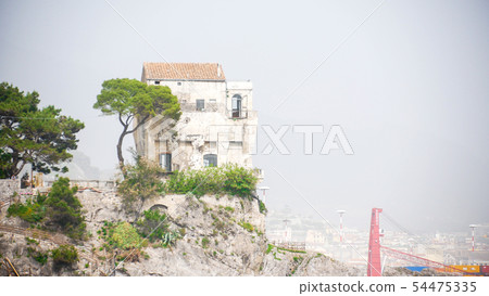 View of the home on the hill above the water 54475335