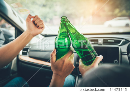 Two male friends are celebrating in the car while Two male friends are celebrating in the car while 54475545