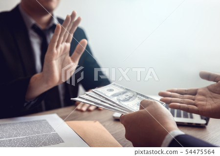 Businessperson refusing bribe given money by 54475564