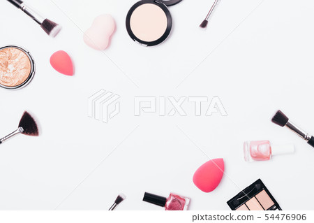 Makeup background of powders, sponges and brushes 54476906