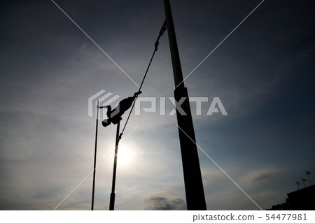 Pole vault silhouette Pole vault silhouette 54477981