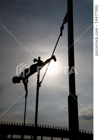 Pole vault silhouette Pole vault silhouette 54477982