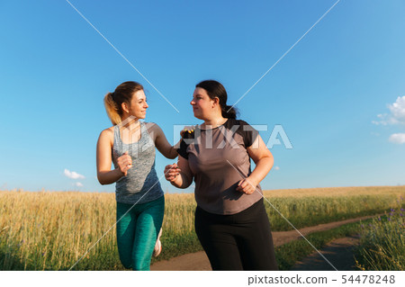 fit woman support and motivate friend at workout fit woman support and motivate friend at workout 54478248