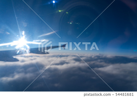 aircraft wing in blue sky with a reflection camera 54481681