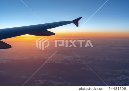 airplane wing silhouette with blue sky horizon 54481806