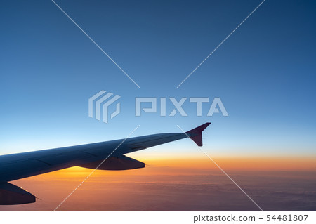 airplane wing silhouette with blue sky horizon 54481807