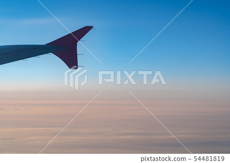 airplane wing silhouette with blue sky horizon 54481819