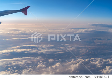 airplane wing silhouette with blue sky horizon 54481821