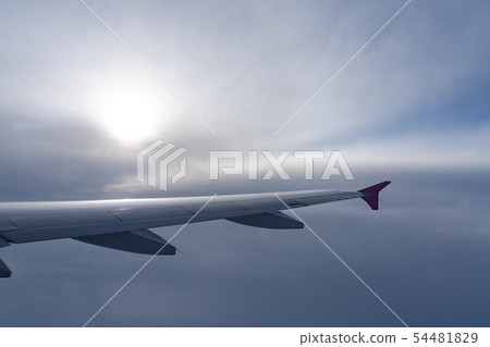 airplane wing silhouette with blue sky horizon 54481829