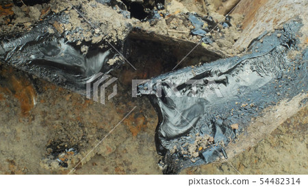 Toxic tar asphalt chemical in detail and closeup clay. Former dump waste, effects nature from 54482314