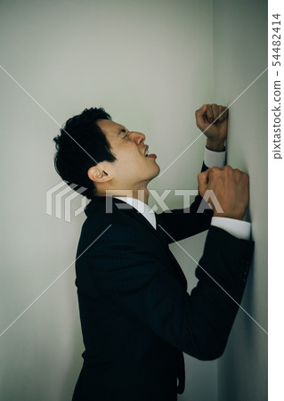 Businessmen hitting a wall Japanese men Businessmen hitting a wall Japanese men 54482414
