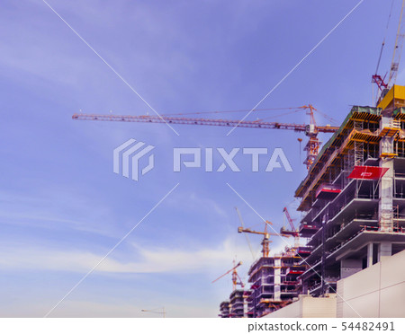 Dubai, UAE December 25/2018 Construction site on blue background. Skyline, cityscape. Urban Dubai, UAE December 25/2018 Construction site on blue background. Skyline, cityscape. Urban 54482491