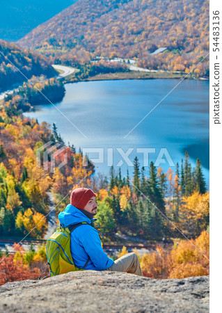 Backpacker man at Artist's Bluff in autumn Backpacker man at Artist's Bluff in autumn 54483136