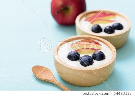 Yoghurt with apple and grape in a bowl Yoghurt with apple and grape in a bowl 54483152