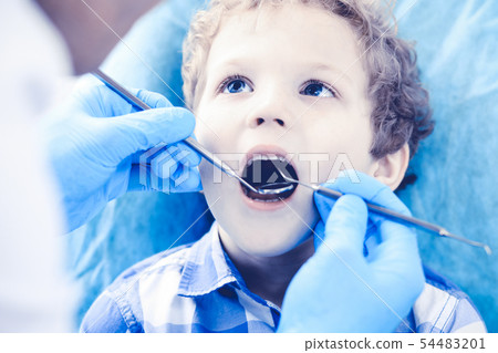 Doctor and patient child. Boy having his teeth examined with dentist. Medicine, health care and Doctor and patient child. Boy having his teeth examined with dentist. Medicine, health care and 54483201