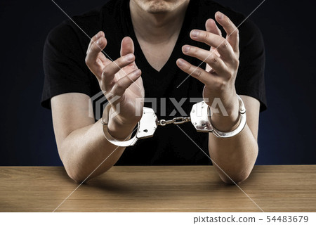 Male handcuffed 54483679