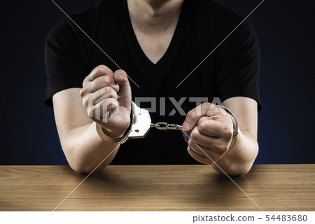 Male handcuffed Male handcuffed 54483680
