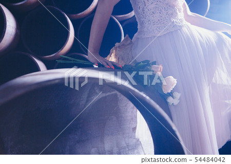 bouquet of roses close-up in the hand of a girl 54484042