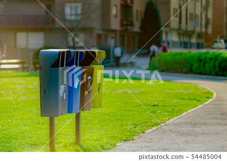 Recycle bin. Communal trash bin near the street. 54485004
