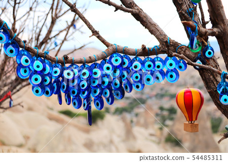 Evil eye charms hang from a tree in Cappadocia, 54485311