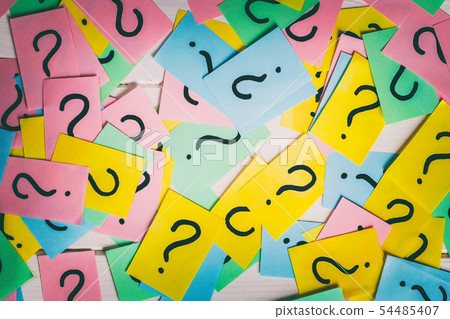 colorful paper notes with question marks. Closeup colorful paper notes with question marks. Closeup 54485407