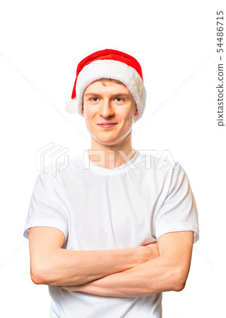 Young man in santa claus hat isolated on white background. 54486715