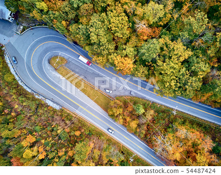 Scenic highway hairpin turn in autumn 54487424