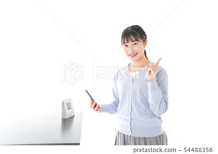 Young woman doing cashless payment 54488356