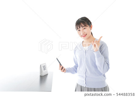 Young woman doing cashless payment 54488358