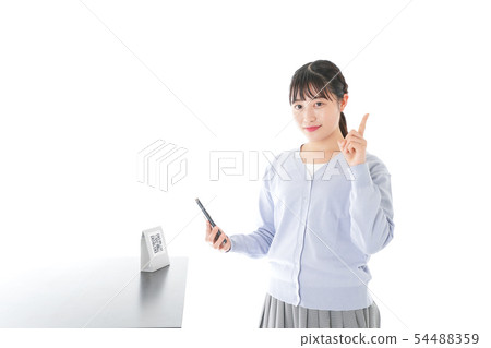 Young woman doing cashless payment Young woman doing cashless payment 54488359