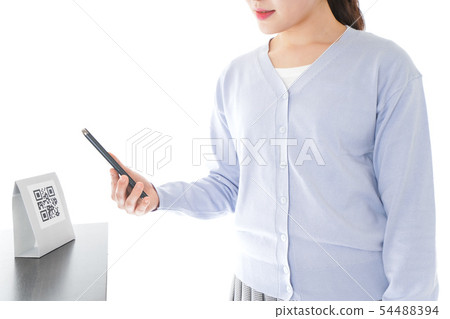 Young woman doing cashless payment 54488394