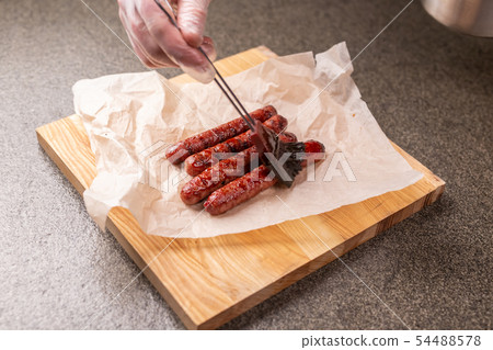 Food concept - Traditional horse meat sausage covered with sauce 54488578