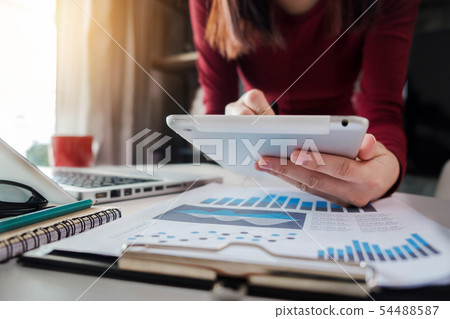 business diagrams and women working in the office. business diagrams and women working in the office. 54488587