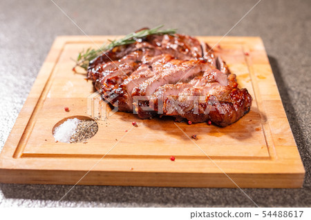 food, delicious and craft concept - cutting horse meat steak on wooden desk food, delicious and craft concept - cutting horse meat steak on wooden desk 54488617