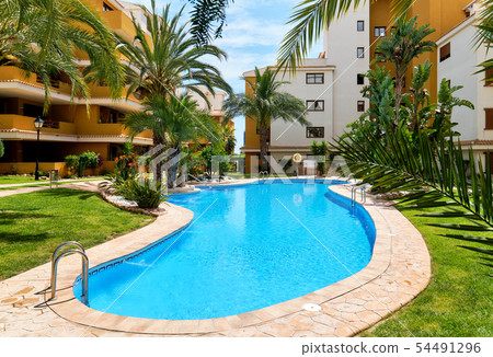 Residential high rise building and pool Residential high rise building and pool 54491296