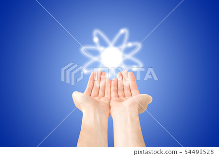 Atom structure model in hands Atom structure model in hands 54491528