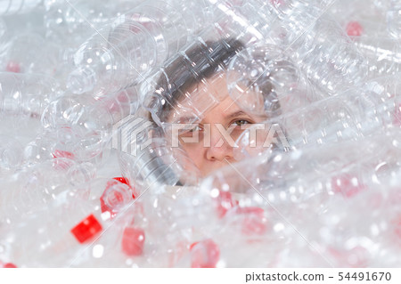 Environmental Protection, people and recyclable plastic concept - exhausted woman concerned with Environmental Protection, people and recyclable plastic concept - exhausted woman concerned with 54491670