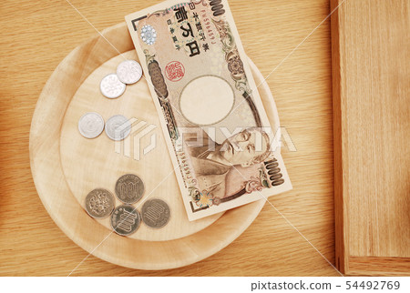 Ten thousand yen banknote,coins yen in wooden tray 54492769