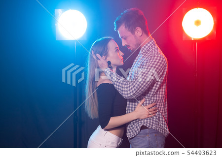 Social dance, kizomba, salsa and semba concept - young beautiful couple dancing bachata or salsa in Social dance, kizomba, salsa and semba concept - young beautiful couple dancing bachata or salsa in 54493623