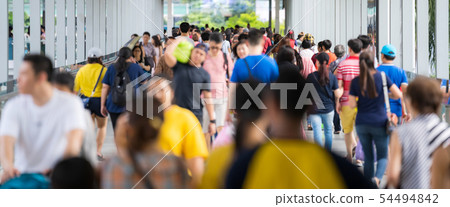 Crowd of anonymous people walking on the city 54494842