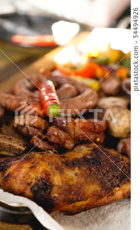 Mixed grilled meat platter. Assorted delicious grilled meat with vegetable. 54494926