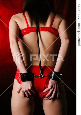 BDSM outfit for adult sex games. A young woman 54497859